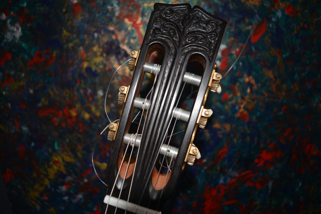 Carved Ebony headstock